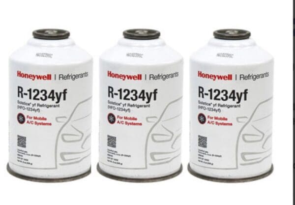 Cans of Honeywell R-1234yf refrigerant for automotive AC systems.